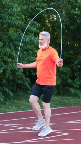 Elison Park | Senior man jumping rope