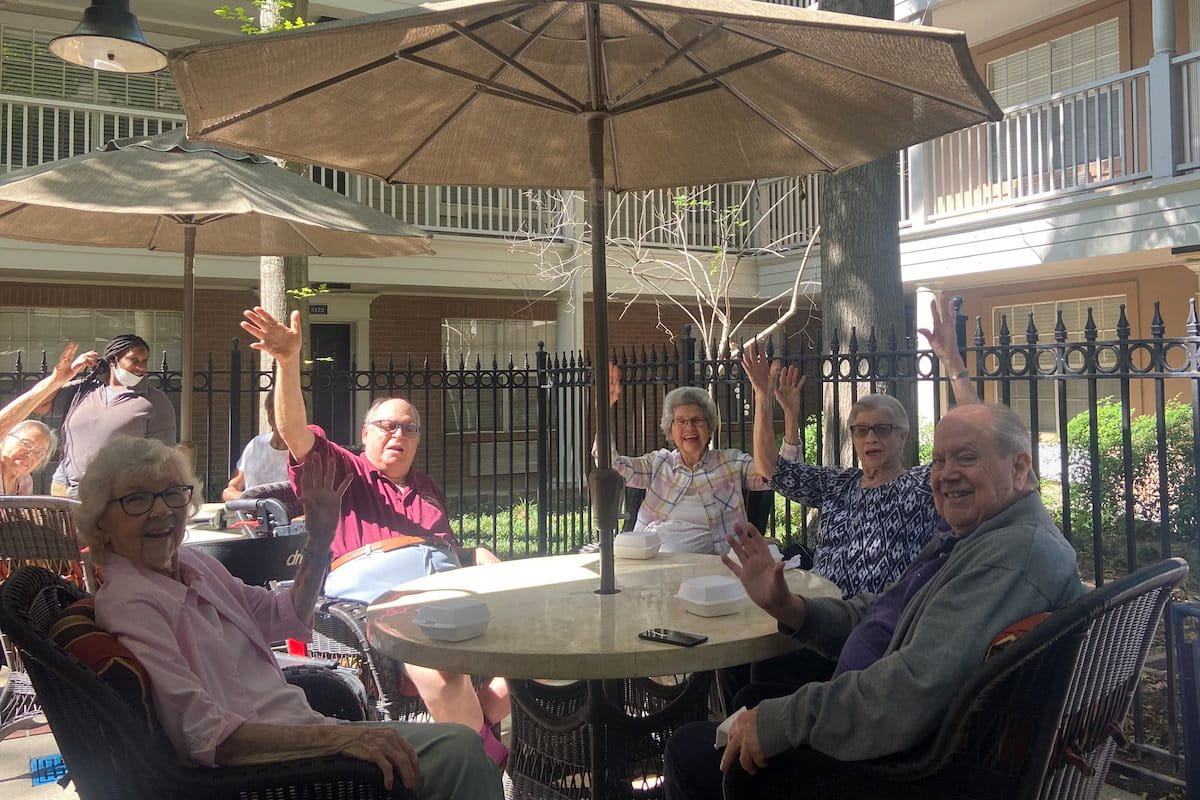 Elison Park Independent Living | Seniors sitting on the patio